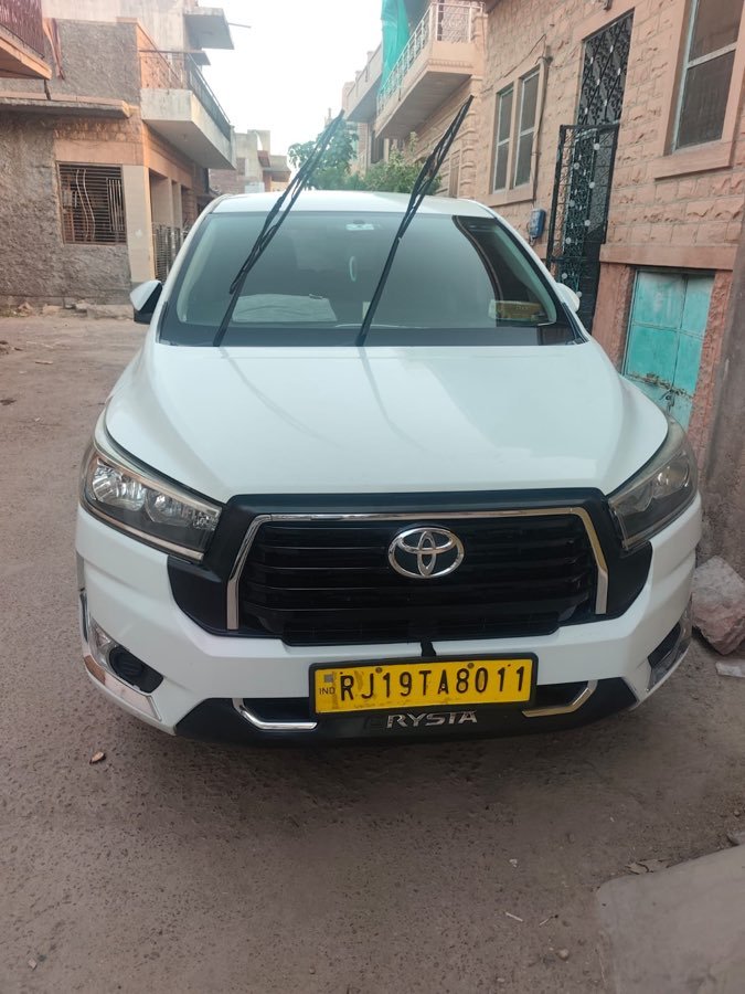 An Innova SUV parked in the old city lanes