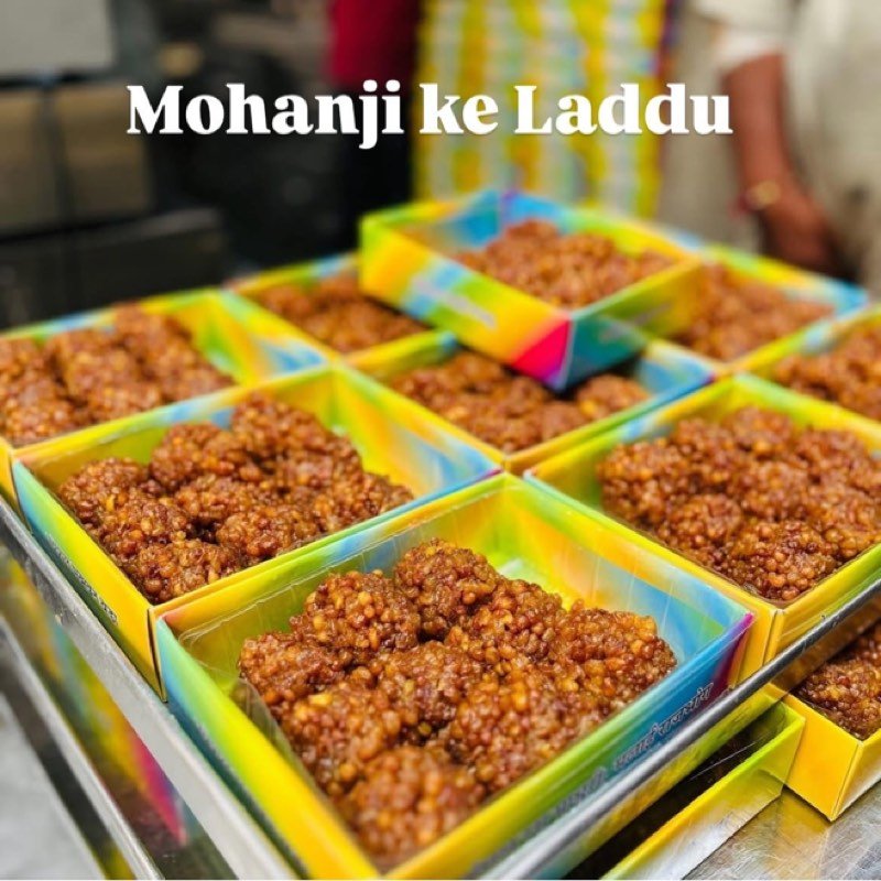 Trays of Mohanji ke laddu on a sweet shop counter