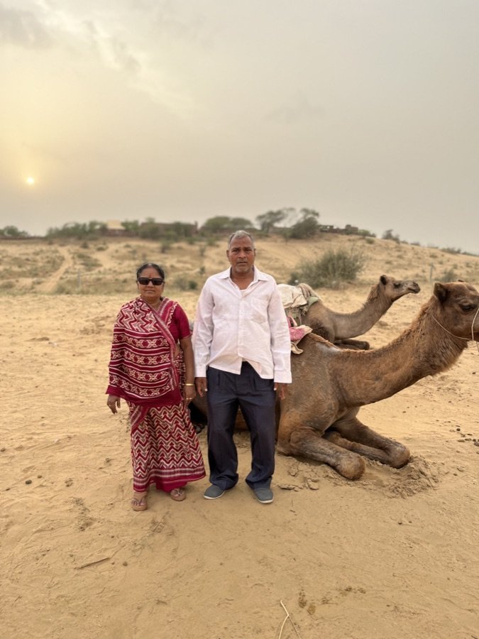 Guests with their camels in the Thar at sunset