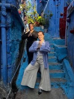 A namaste on the blue steps