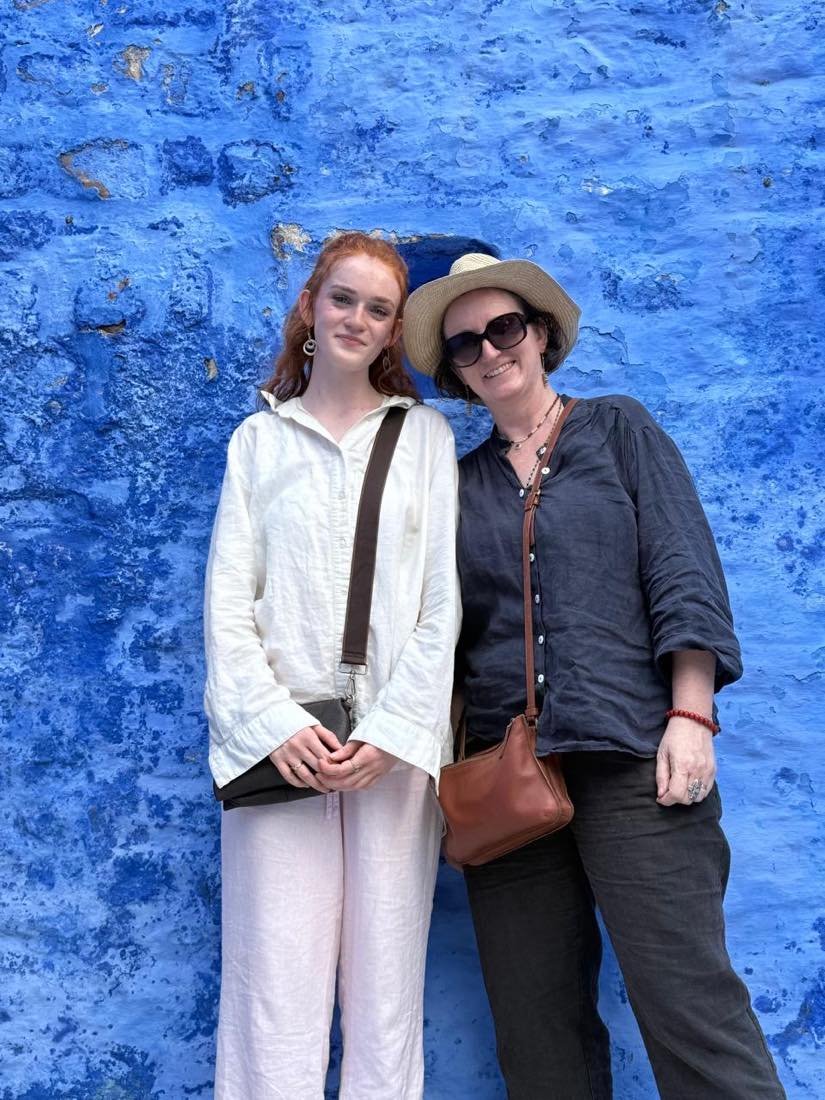 Guests against a freshly washed indigo wall